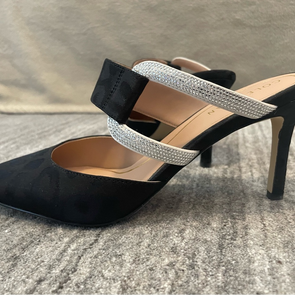 Black Cole Haan Sandal with decorative Silver embellishment.